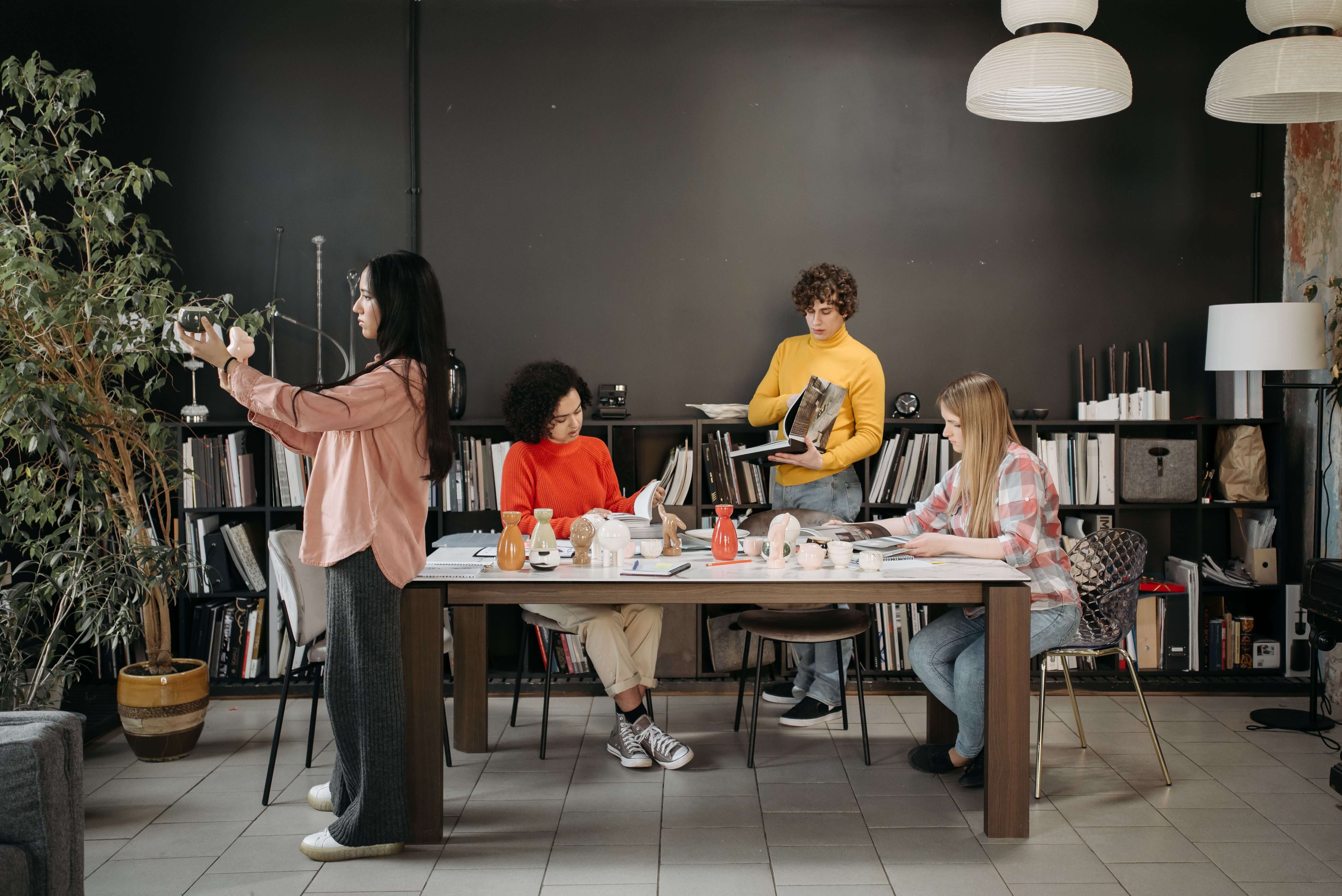 A client and agency team meeting across a table to talk through a project brief